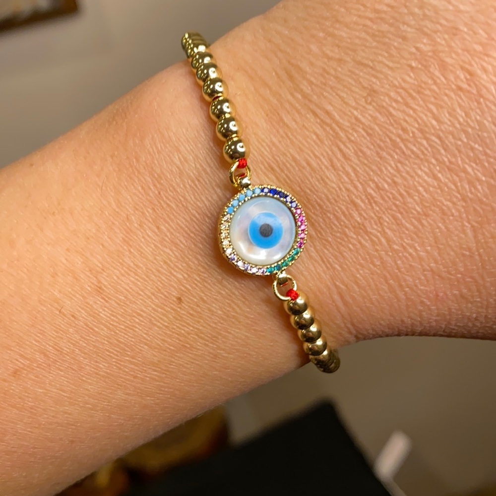 Evil eye bracelet with red string, round
